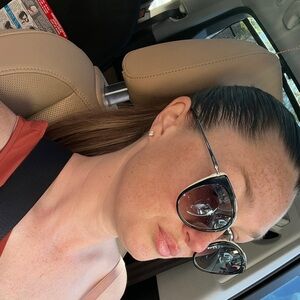 Prada Black Cat-Eye Sunglasses with Silver Temples